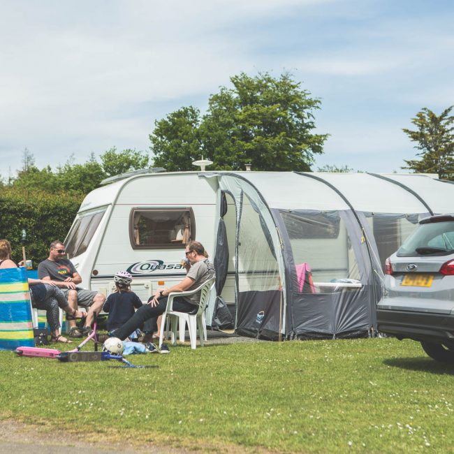 family enjoying camping tent holiday at Forest Glade